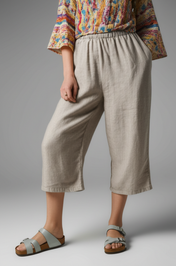 Contemporary orthopedic sandals styled with breezy linen culottes and a colorful blouse