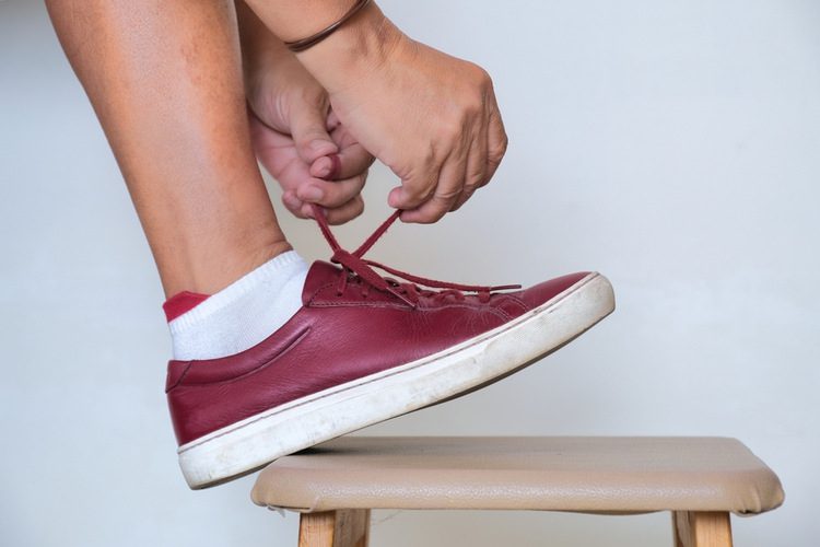  Tying up shoe lace of sneakers