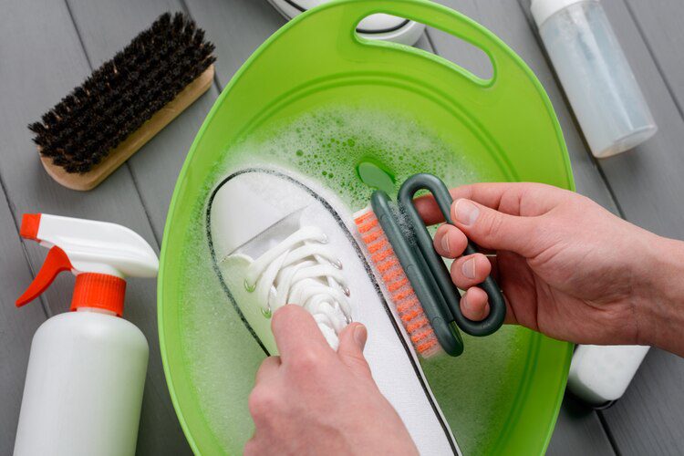 Using soap to clean shoes 