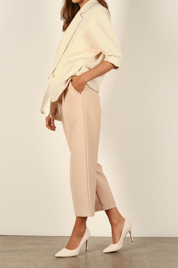 Pairing affordable designer heels with neutral outfits for effortless chic